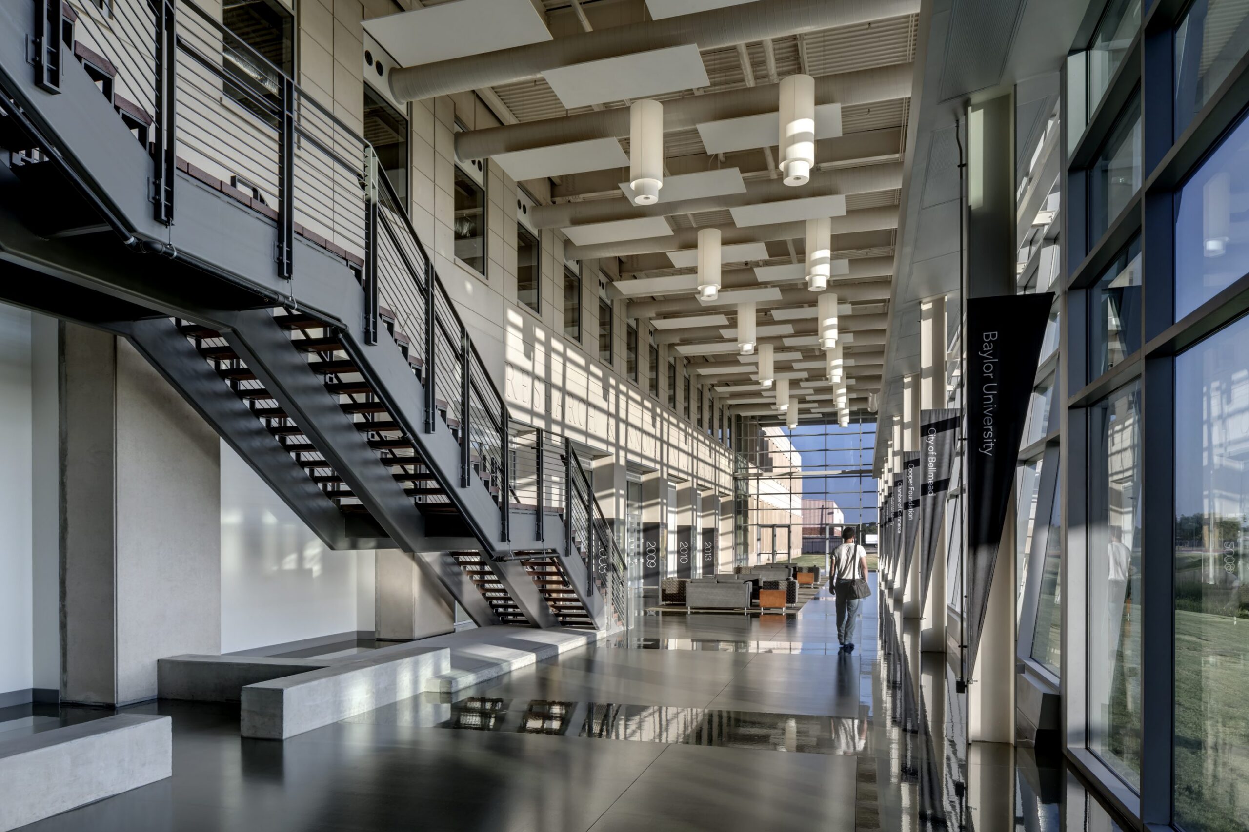 Modern atrium with staircase and glass facade