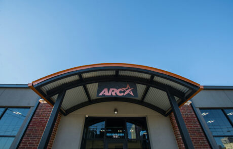 ARCA entrance with curved metal awning
